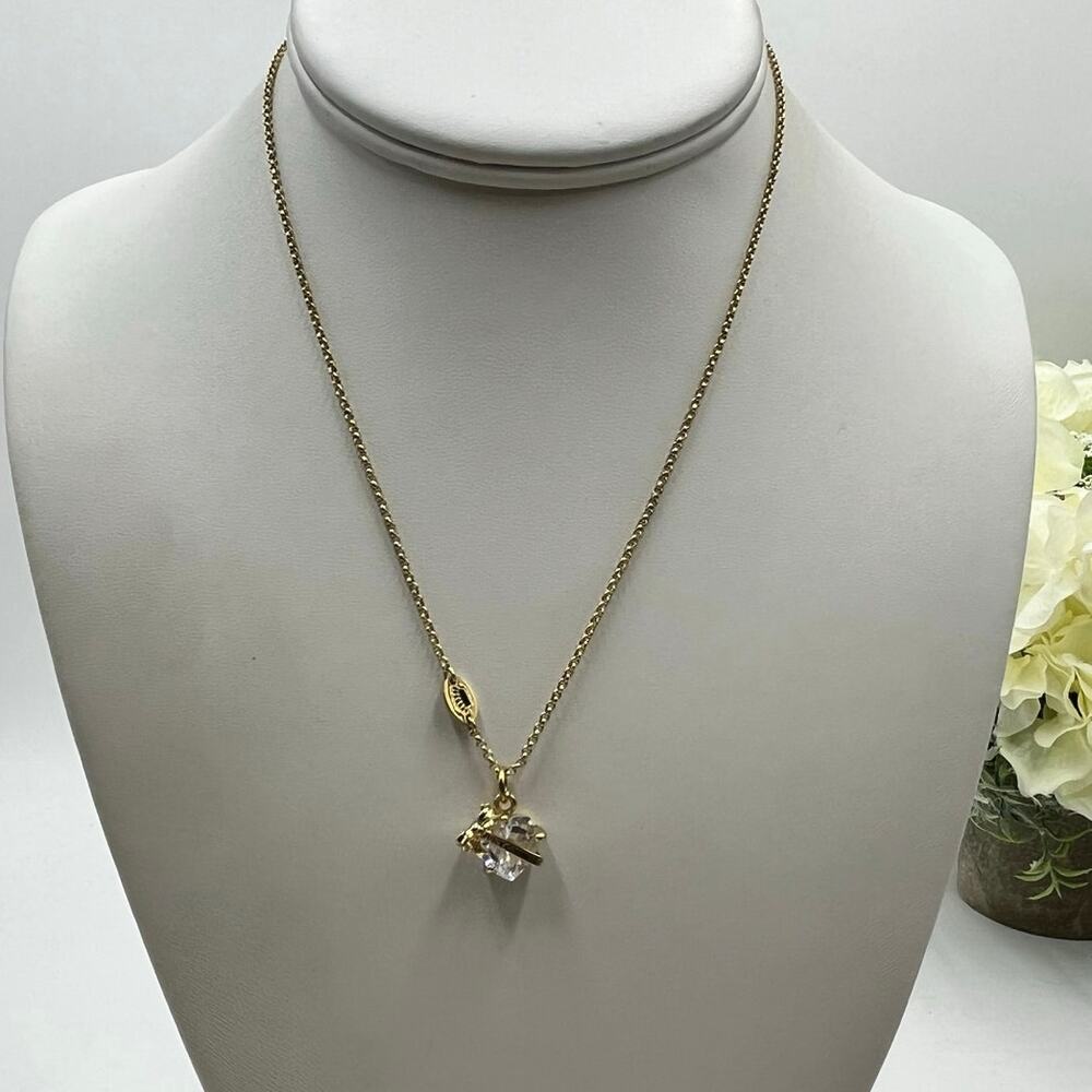 Juicyā Couture Clear Heart Gold Tone Banner and Bow Pendant Necklace Hangtag